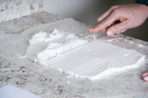 marble paper science project - level shaving cream with a ruler