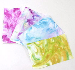 Learn to marble paper easily with acrylic paint, corn starch and water!